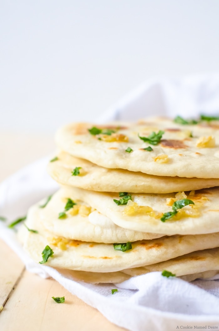 Warm, soft homemade naan bread is easier to make than you may think. This easy bread recipe is the perfect accompaniment to your dinner or as a snack!