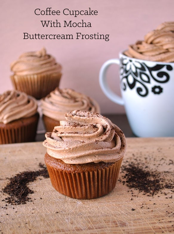 coffee cupcakes with mocha buttercream frosting on a board