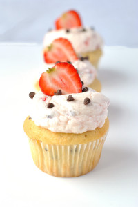 chocolate chip cupcakes with strawberry whipped cream frosting