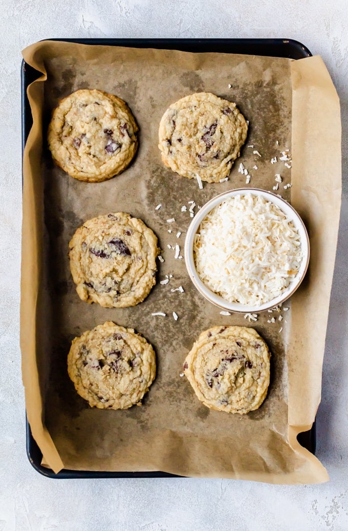 Baked baking sheet of coconut chocolate chip cookies