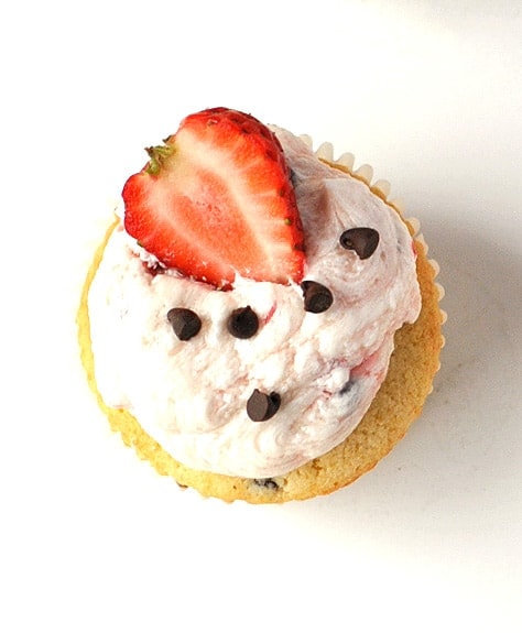 chocolate chip cupcakes with strawberry whipped cream frosting