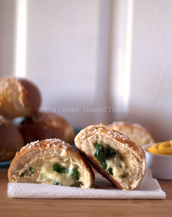 brie and spinach stuffed pretzel rolls