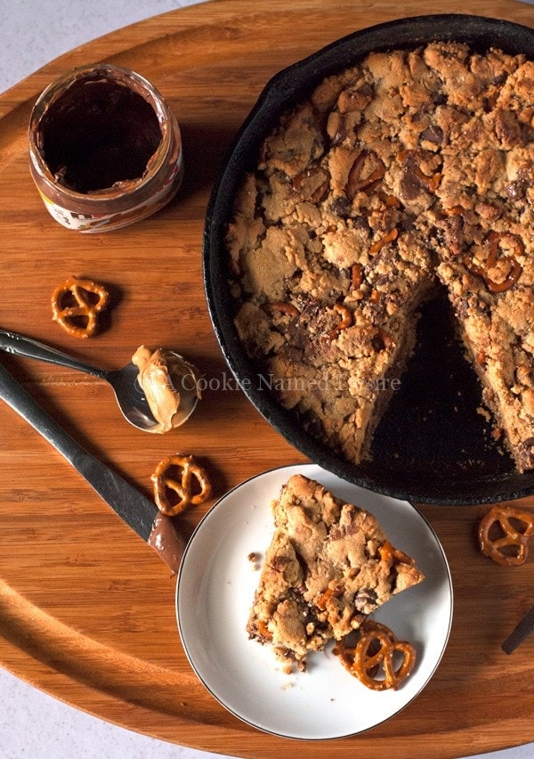 peanut butter chocolate chip and pretzel skillet cookie with nutella