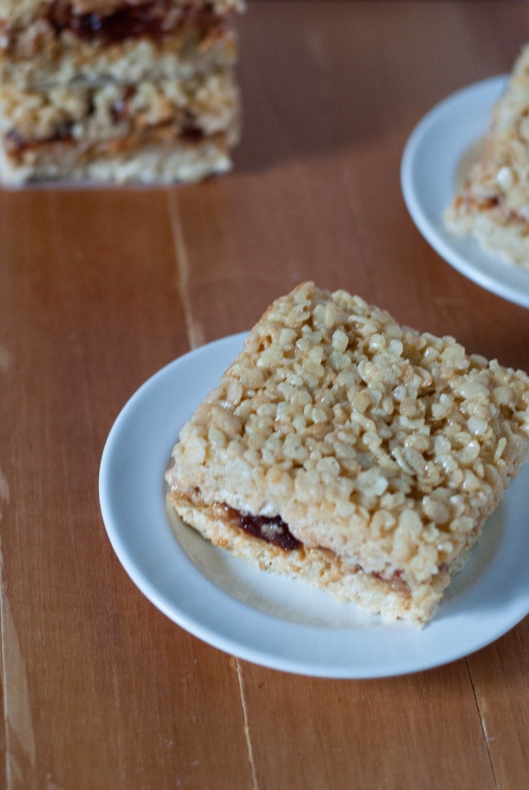 Peanut Butter and Jelly Rice Krispie Treats. These little treats combine two childhood favorites in one. | cookienameddesire.com