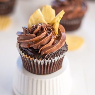 An incredible chocolate "chip" cupcake with coffee glaze, chocolate ganache, right chocolate buttercream, caramel drizzle, fleur de sel and potato chips. Heaven in a cupcake.