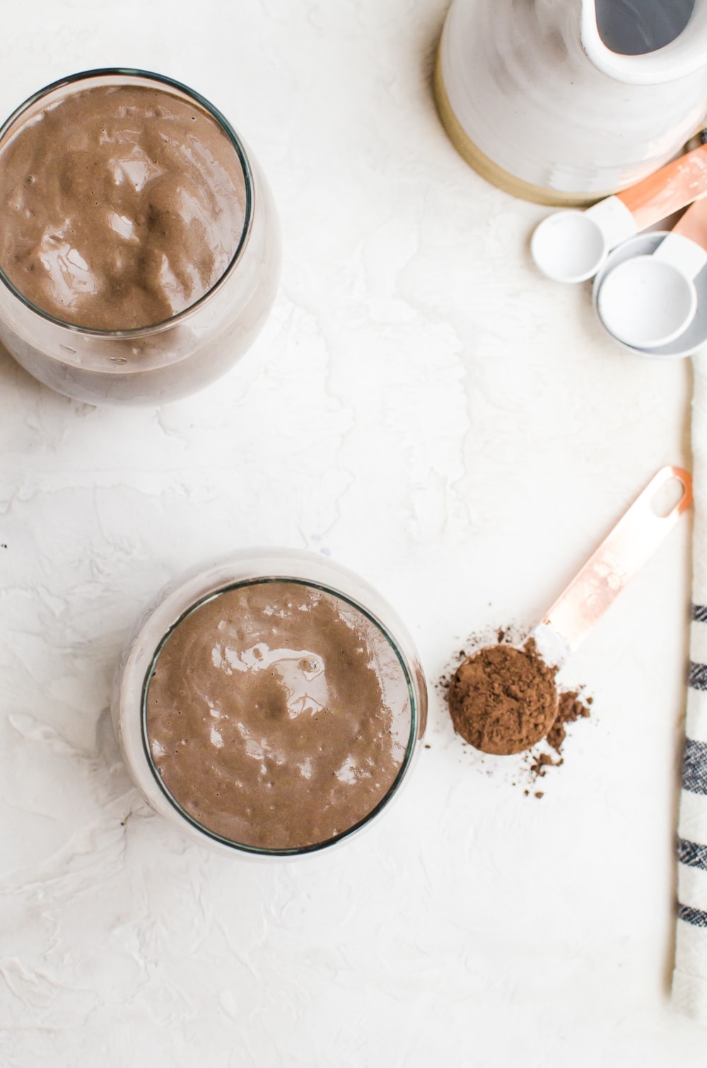 avocado chocolate peanut butter smoothie in a glass overhead