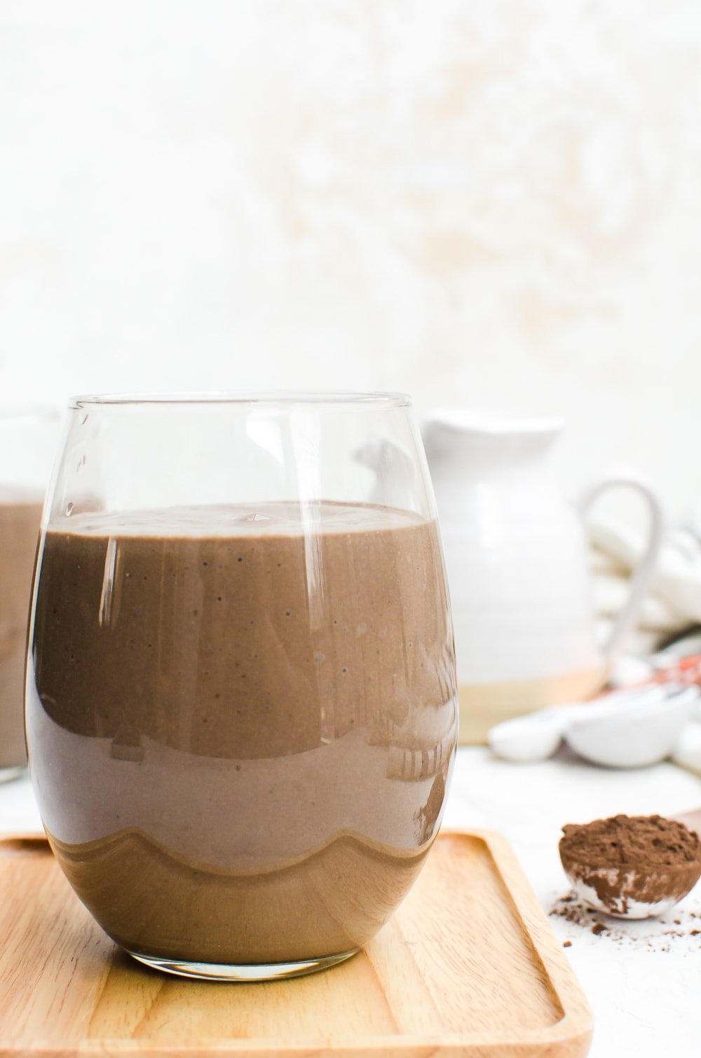 avocado chocolate peanut butter smoothie in a glass close up