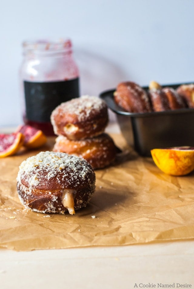 Blood orange cream-filled doughnuts. The perfect doughnuts with a crisp outer and soft, fluffy bread inside and a sweet, tangy cream