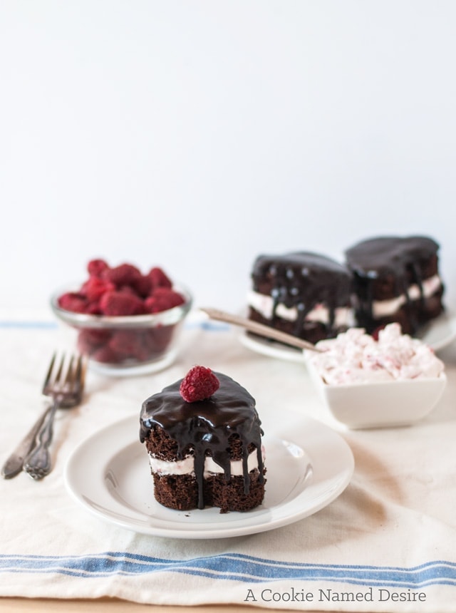 Valentine's Day dessert: mini heart-shaped chocolate cakes with rapsberry whipped cream and ganache