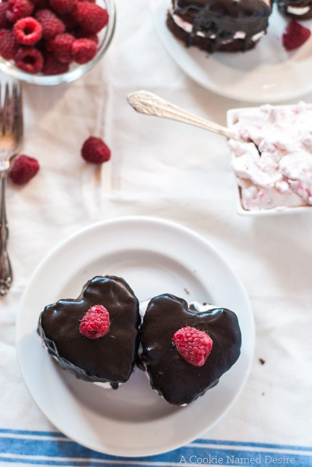 Mini heart-shaped hocolate cakes with raspberry whipped cream and ganache - perfect for Valentine's Day