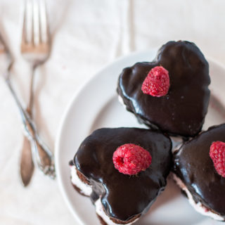 Heart-shaped chocolate cake with raspberry whipped cream - the perfect romantic dessert