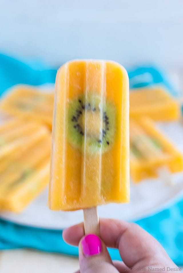 Cool down with a mango kiwi lemonade popsicle