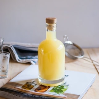 bottle of limoncello on top of book