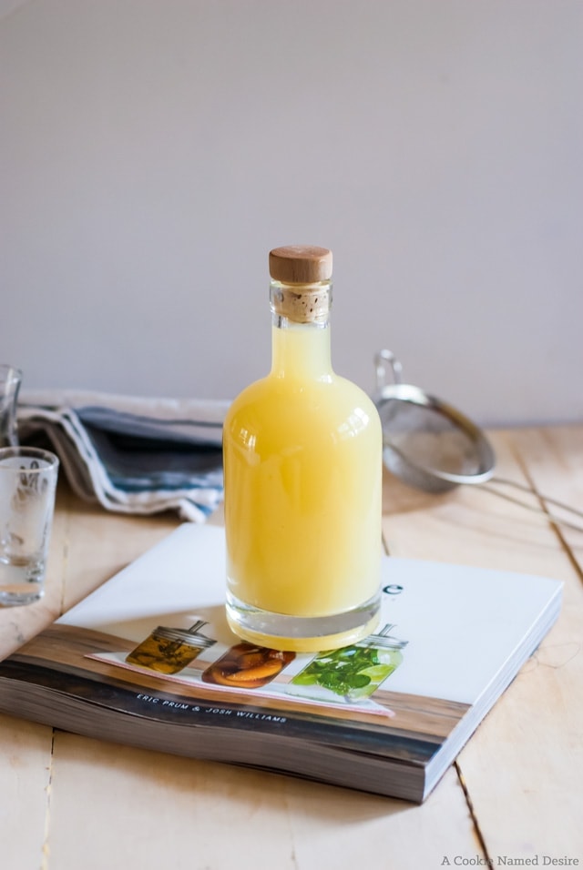 bottle of limoncello on top of book