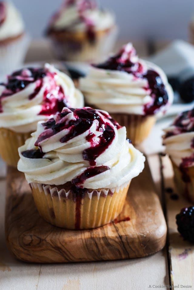 Light and fluffy cupcakes are infused with a hint of lime, then swirled with a simple blackberry jam. They are then topped with a lime frosting and more blackberry jam. I think these blackberry lime cupcakes are seriously my favorite cupcakes ever! They are so delicious and so pretty! 