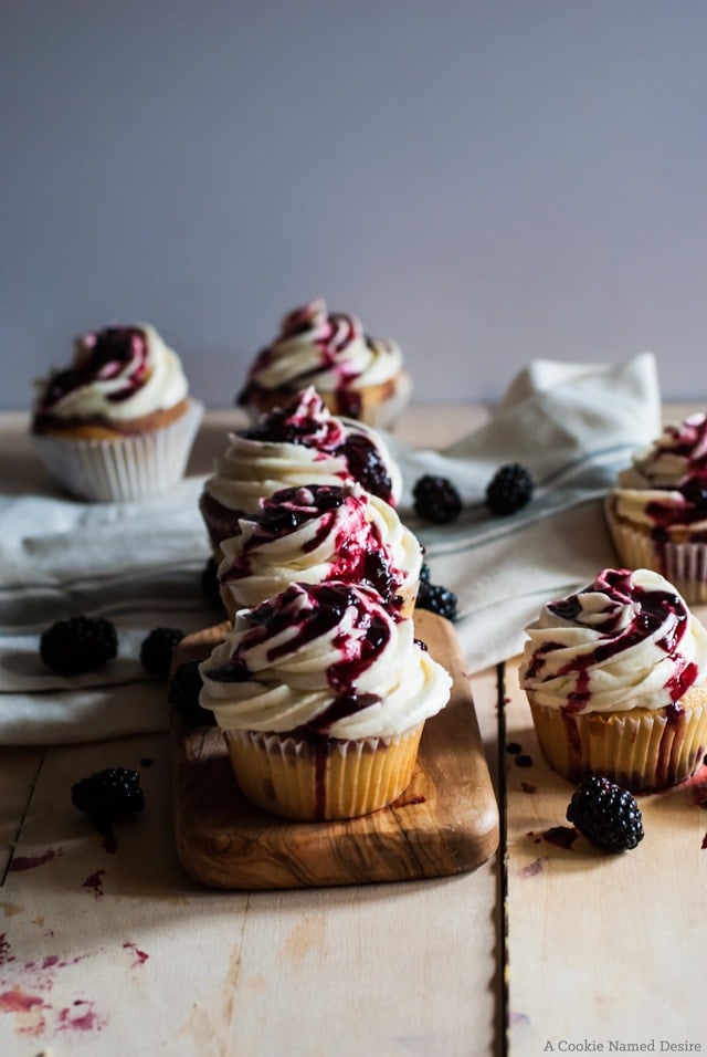 Blackberry swirl cupcakes with lime frosting and a blackberry Jam drizzle. These cupcakes are as tasty as they are pretty. My family can't get enough. 