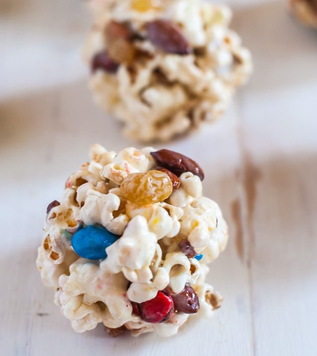 Enjoy movie night with these delicious trail mix easy popcorn balls made with no corn syrup