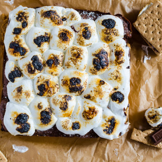 S'mores brownies - buttery graham cracker crust, fudgy brownies, and toasted marshmallow come together to great an unforgettable desert.