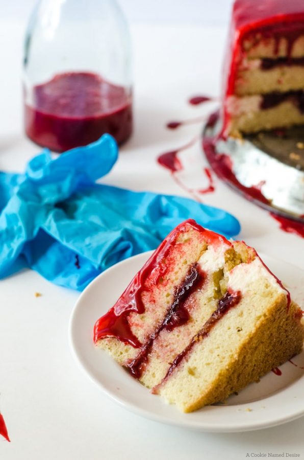 Gory white cake with raspberry jam and a bloog red velvet ganache