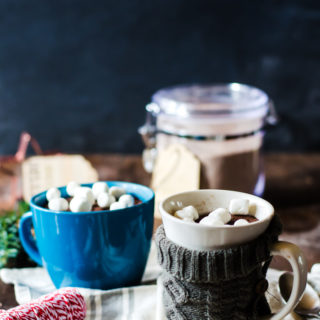 This easy hot chocolate mug cake mix makes the perfect holiday gift for anyone in your life who loves hot chocolate and cake! This delicious dessert cooks up in a minute and is so addictive!