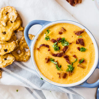 Deliciously irresistible bacon beer cheese dip. Perfect for all your game day parties!