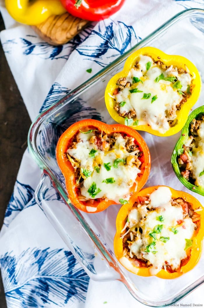 These cheesy turkey stuffed peppers make an easy dinner recipe that is sure to please the entire family!
