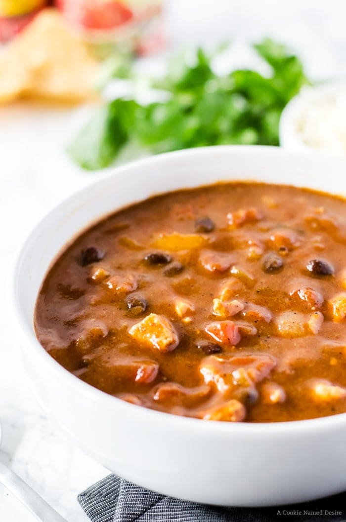 No one will believe this easy chicken enchilada soup was finished in under 30 minutes! It is rich, full of flavor, and bound to be your new favorite weeknight dinner recipe.