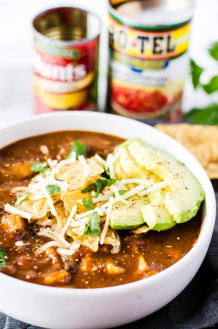 No one will believe this easy chicken enchilada soup was finished in under 30 minutes! It is rich, full of flavor, and bound to be your new favorite weeknight dinner recipe.