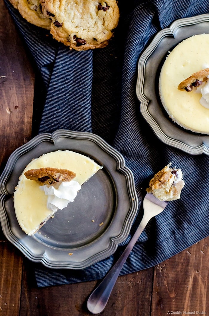 Mini Chocolate Chip Cookie Dough Cheesecake.... velvety smooth vanilla cheesecakes stuffed with chocolate chip cookie dough. Topped with fresh whipped cream and a mini chocolate chip cookie. The ultimate dessert-lovers treat