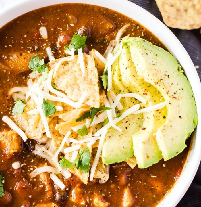 No one will believe this easy chicken enchilada soup was finished in under 30 minutes! It is rich, full of flavor, and bound to be your new favorite weeknight dinner recipe.