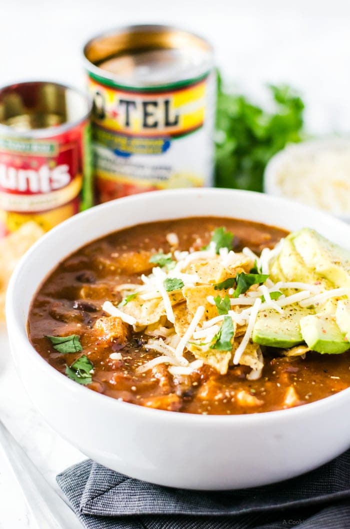 No one will believe this easy chicken enchilada soup was finished in under 30 minutes! It is rich, full of flavor, and bound to be your new favorite weeknight dinner recipe.