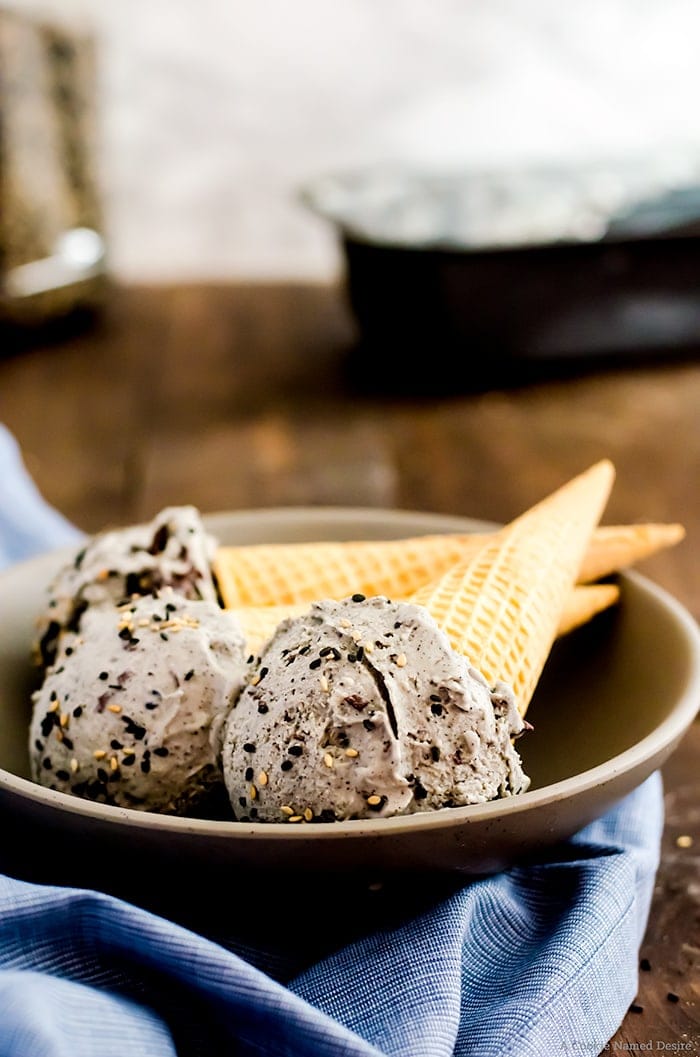 Black sesame ice cream is a sweet, nutty, and unique treat complemented with shards of chocolate studded throughout. You are going to fall in love with its fun color and rich, roasted flavor.