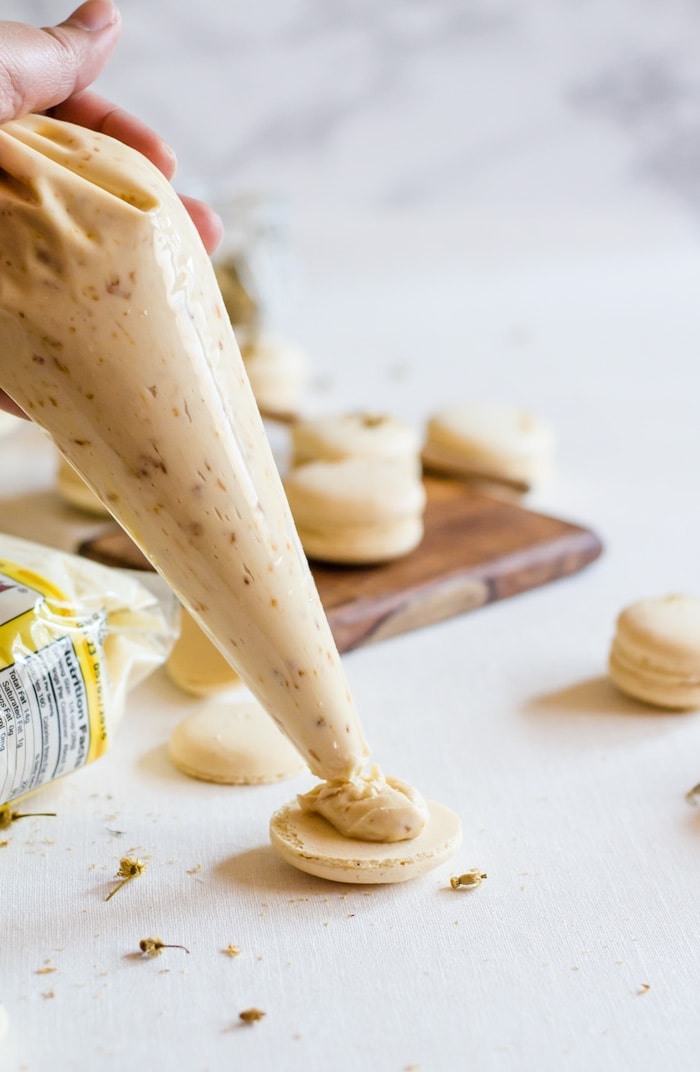 These chamomile and caramelized honey macarons are the perfect treat for all your spring gatherings. The macaron shells are delicately flavored with chamomile and filled with a lightly salted caramelized honey buttercream. It’s Spring in a single bite.