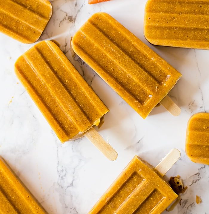 Carrot cake popsicles are a delightfully refreshing take on the classic cake. Made with fresh carrots and all the aromatic spices and flavors we love in traditional carrot cake. This simple popsicle recipe is made easily in a blender in just moments!