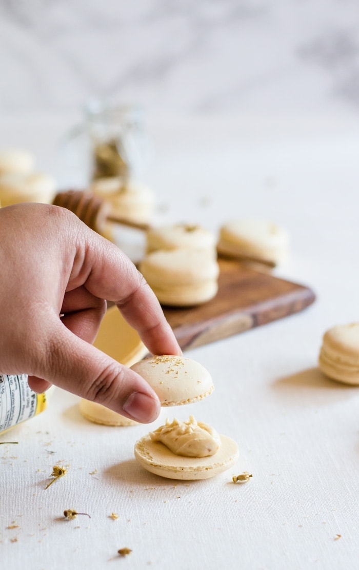 These chamomile and caramelized honey macarons are the perfect treat for all your spring gatherings. The macaron shells are delicately flavored with chamomile and filled with a lightly salted caramelized honey buttercream. It’s Spring in a single bite.