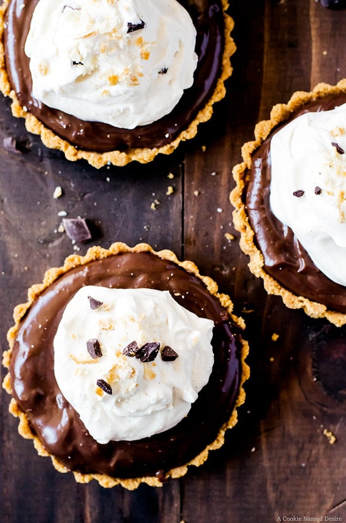 Lusciously smooth chocolate pudding tarts with a sweet and salty cracker crust. This easy no-bake recipe proves sweet and salty is the best flavor combination.