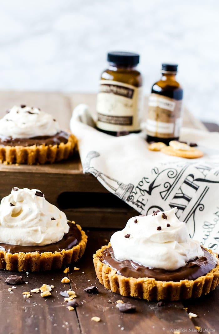 Lusciously smooth chocolate pudding tarts with a sweet and salty cracker crust. This easy no-bake recipe proves sweet and salty is the best flavor combination.