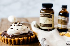 Chocolate pudding tart with a cracker crust and fresh whipped cream