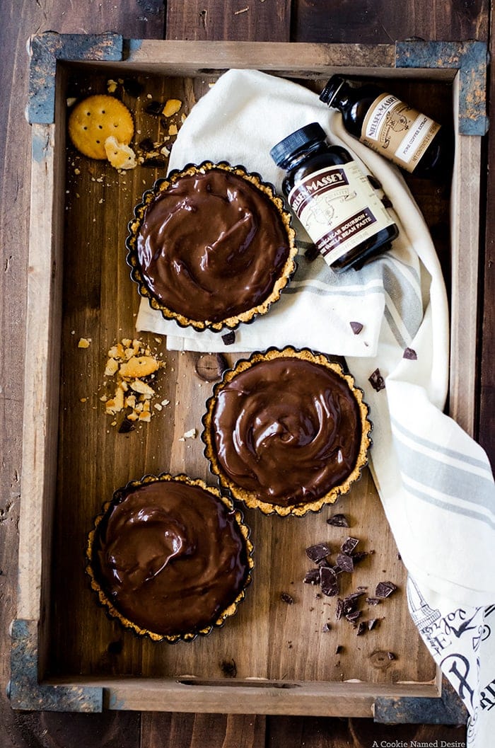 Lusciously smooth chocolate pudding tarts with a sweet and salty cracker crust. This easy no-bake recipe proves sweet and salty is the best flavor combination.