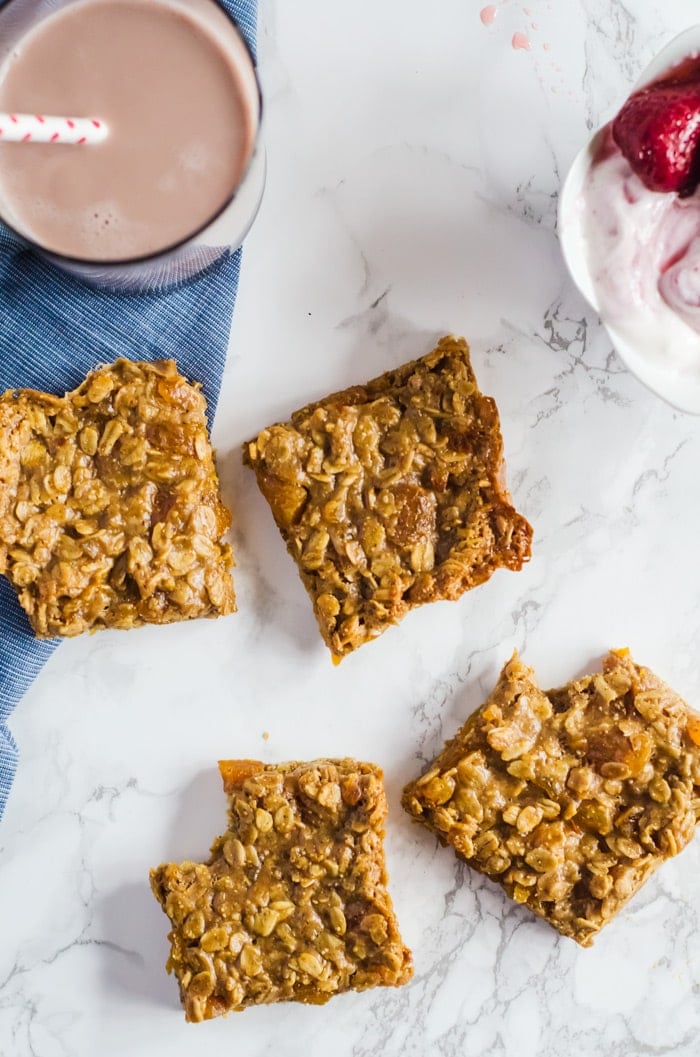 Four ingredient apricot almond butter oat bars are the perfect healthy snack that will keep you satisfied and full until mealtime. Pair with a glass of milk for an even more balanced treat! 