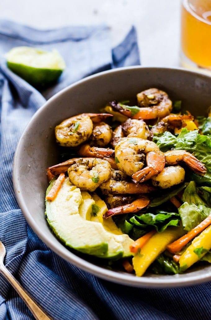 A fun and flavorful jerk shrimp salad that will transport you to an island vacation with a single bite. This easy salad recipe is light in calories but packed with flavor. 