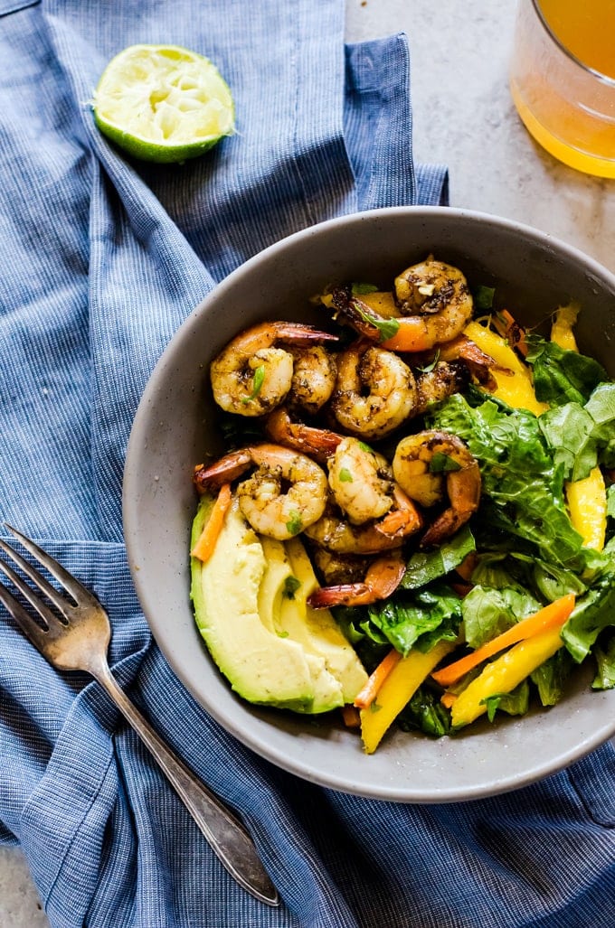 A fun and flavorful jerk shrimp salad that will transport you to an island vacation with a single bite. This easy salad recipe is light in calories but packed with flavor. 