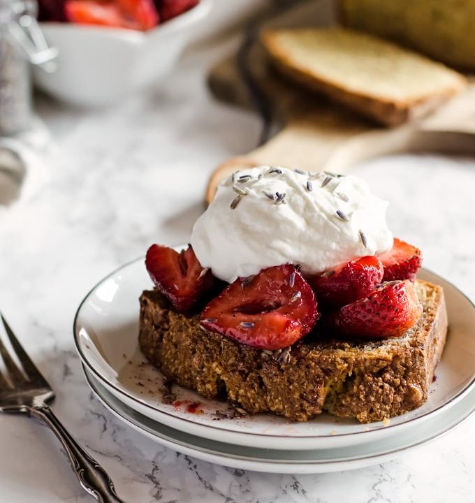 A rich and nutty pistachio pound cake recipe topped with vanilla lavender strawberries and fresh whipped cream. This is a wonderful dessert to enjoy in the evening with a cup of coffee.