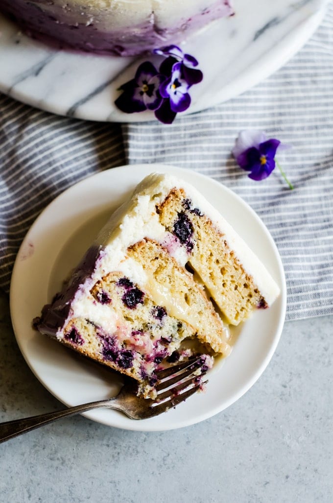 A beautiful lemon blueberry cake studded with juicy wild blueberries