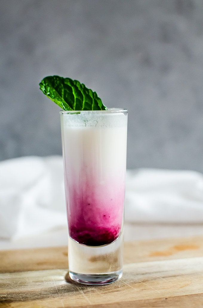 A creamy and irresistible coconut lime mojito shooter with a blueberry swirl. Aka the best shot you will ever make. 