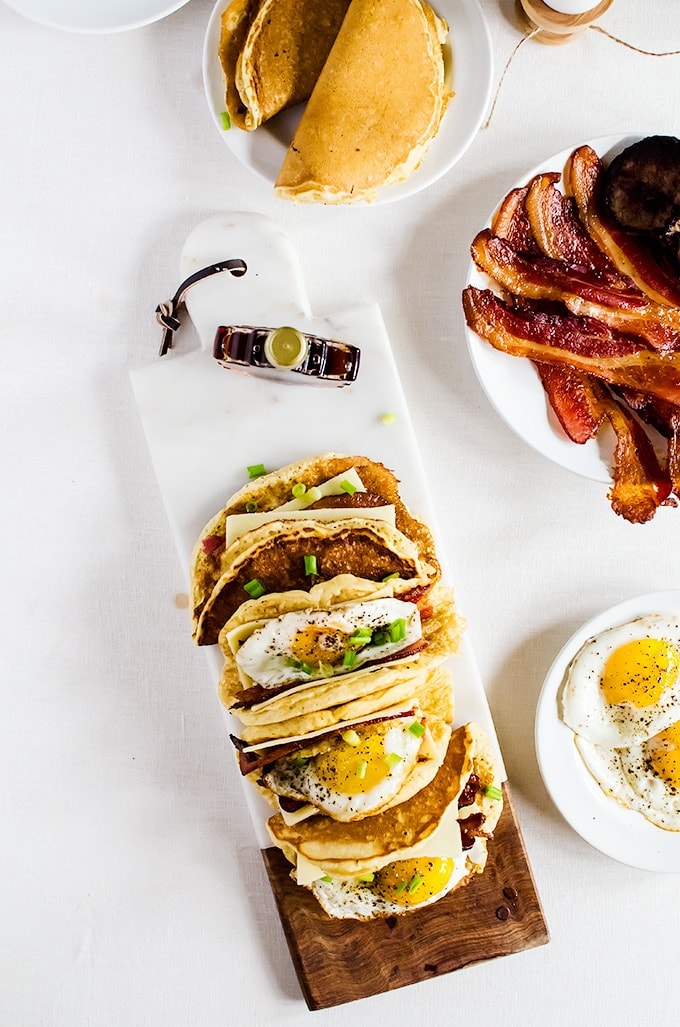 American breakfast tacos. Light and fluffy pancakes act as a vehicle for thick slices of bacon, melted cheese, and fried eggs. Smother the whole thing in maple syrup and you have the best breakfast ever!