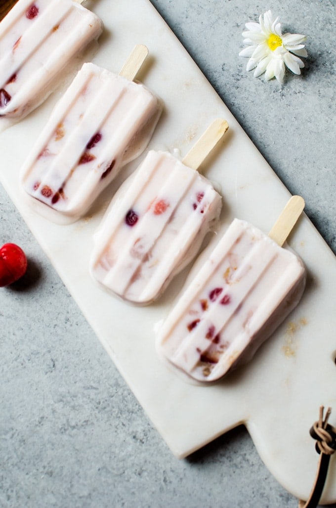 Sweet and irresistibly refreshing lychee cherry frozen yogurt popsicles that will have you wanting to eat the entire batch. 