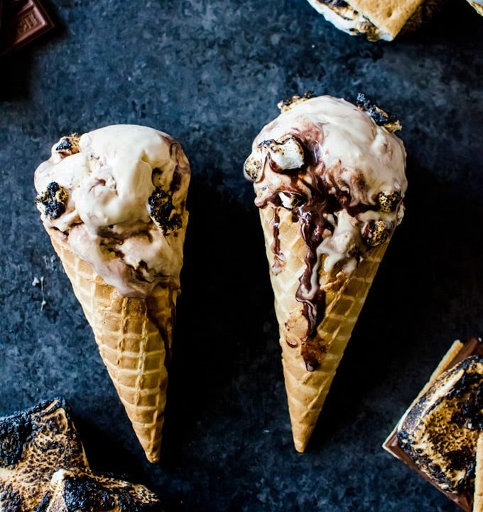 Graham cracker infused ice cream with swirls of chocolate and tons of roasted marshmallows. This s'mores ice cream has it all.