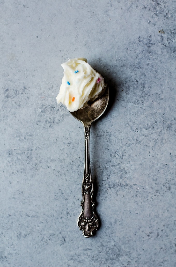 Cake batter + frosting unite to create the most irresistible thing you will ever taste. This cake batter frosting is perfect for just about everything! My favorite id dipping pretzel rods in for a sweet and salty treat!