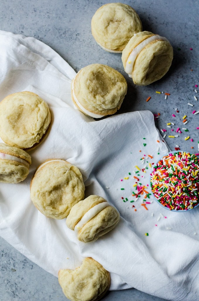 Lemon Sandwich Cookies with Cake Batter Frosting